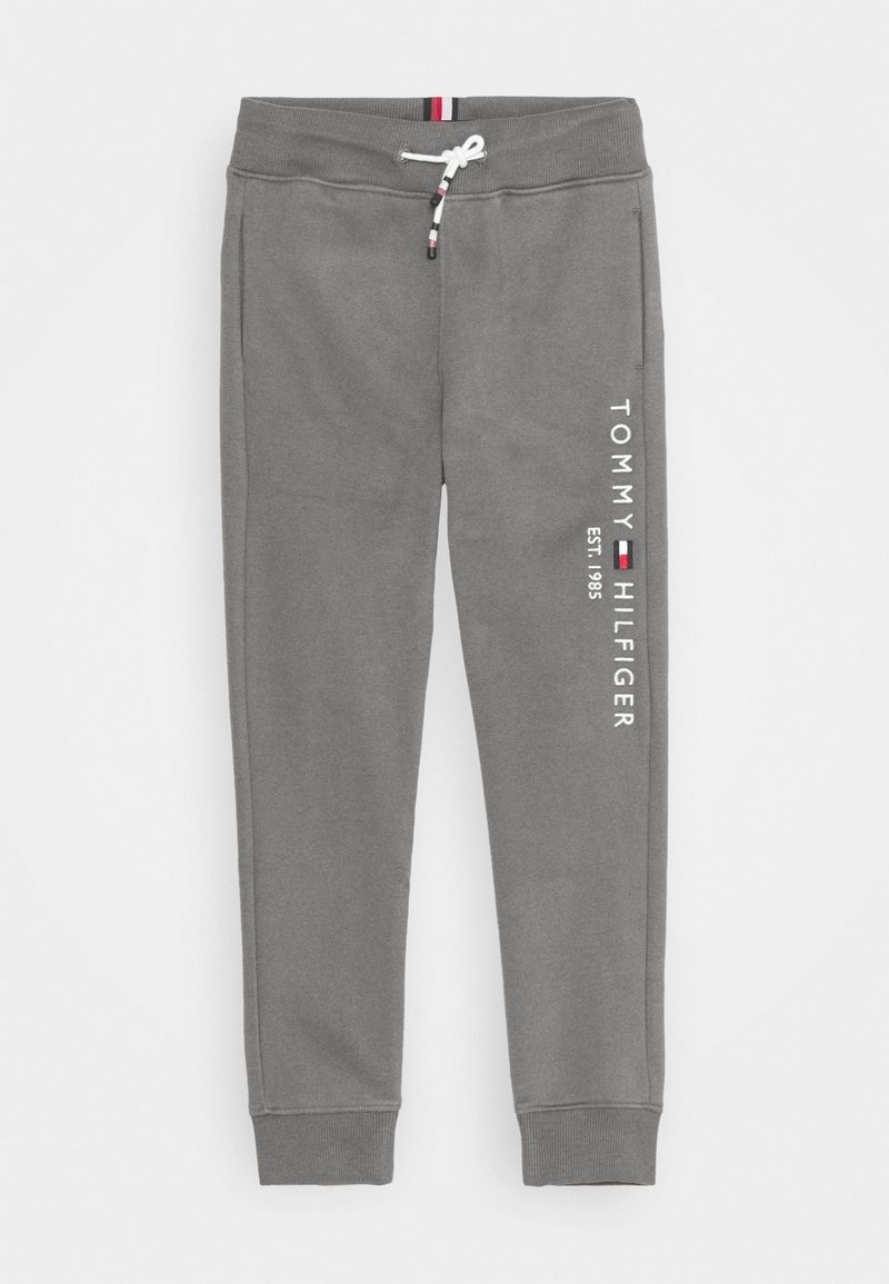 Graue Jogginghose mit elastischem Bund und Bündchen, weißem Kordelzug und vertikalem Tommy Hilfiger-Logo am linken Bein.
