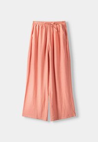 Pantalons large en corail avec taille élastique et cordon de serrage, dotés de poches latérales et d'une coupe décontractée.