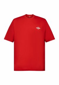 T-shirt in cotone rosso con maniche corte e collo rotondo. Presenta un piccolo logo a forma di diamante bianco sulla zona sinistra del petto.