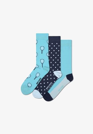 Three pairs of cotton socks: one in light blue with tennis racket print, one in navy with white polka dots, and one in solid light blue.