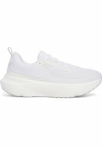 White athletic shoe with a textured mesh upper, rounded sole, and thick, cushioned midsole. Features laces and a pull tab on the heel.