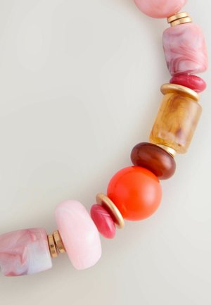 Colorful necklace featuring large, round and rectangular beads in pink, red, orange, and amber with gold accents and varied textures.