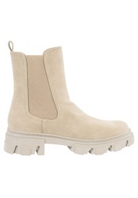 Bottine en daim beige avec semelle en caoutchouc épaisse, panneau latéral élastique et languette de tirage au talon, vue de profil.