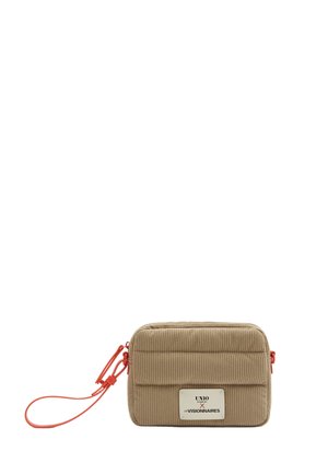 Small beige rectangular pouch with vertical ribbed texture, red wrist strap, and white label reading "UNIO x LES VISIONNAIRES" on front.