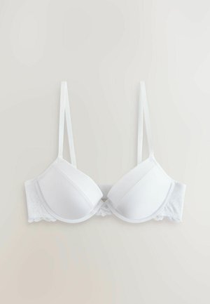 Baltas paminkštintas liemenėlė su reguliuojamais dirželiais, pasižyminti lygiu audiniu ir nėriniuota apačia. Su lankeliais dėl papildomos atramos.