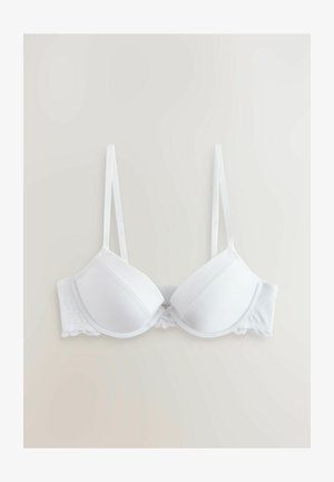 Baltas paminkštintas liemenėlė su reguliuojamais dirželiais, pasižyminti lygiu audiniu ir nėriniuota apačia. Su lankeliais dėl papildomos atramos.