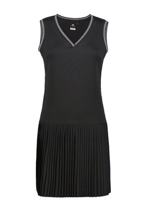 Zwarte mouwloze jurk met een V-hals, met een geplooide rok en contrasterende biezen op de halslijn. Glad stoffen textuur.