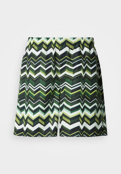 Μαγιό σορτς με ζιγκ-ζαγκ μοτίβο σε αποχρώσεις του πράσινου, μαύρου και λευκού. Κατασκευασμένο από ελαφρύ υλικό με ελαστική μέση.