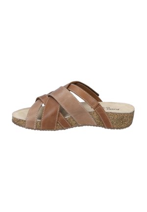 Braune Leder-Sandalen mit Riemen im Kreuzdesign, einer gepolsterten Innensohle und einer strukturierten Korksohle. Akzente umfassen gestickte Details.