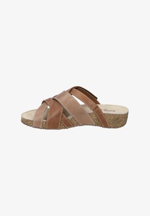 Brown leather slide sandal featuring crisscross straps, a cushioned insole, and a textured cork sole. Accents include stitched details.