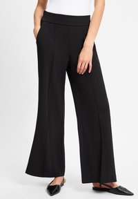 Zwarte wijde pantalons van een soepelere stof met een hoge tailleband en zijzakken, met een strakke, op maat gemaakte uitstraling.