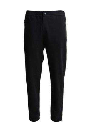 Sorte joggerbukser med elastisk talje, sidelommer med lynlås og tætsiddende ben. Fremstillet af blødt stof med en glat overflade.