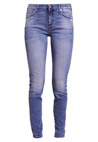 Smala blå jeans i denim, med medelhög midja, femfickorsdesign och lätt blekning längs låren för textur.