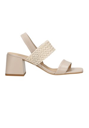 Sandalo con tacco color beige e cinturino superiore intrecciato, con un tacco solido. Design open-toe. Texture liscia con tacco a blocco per maggiore stabilità.