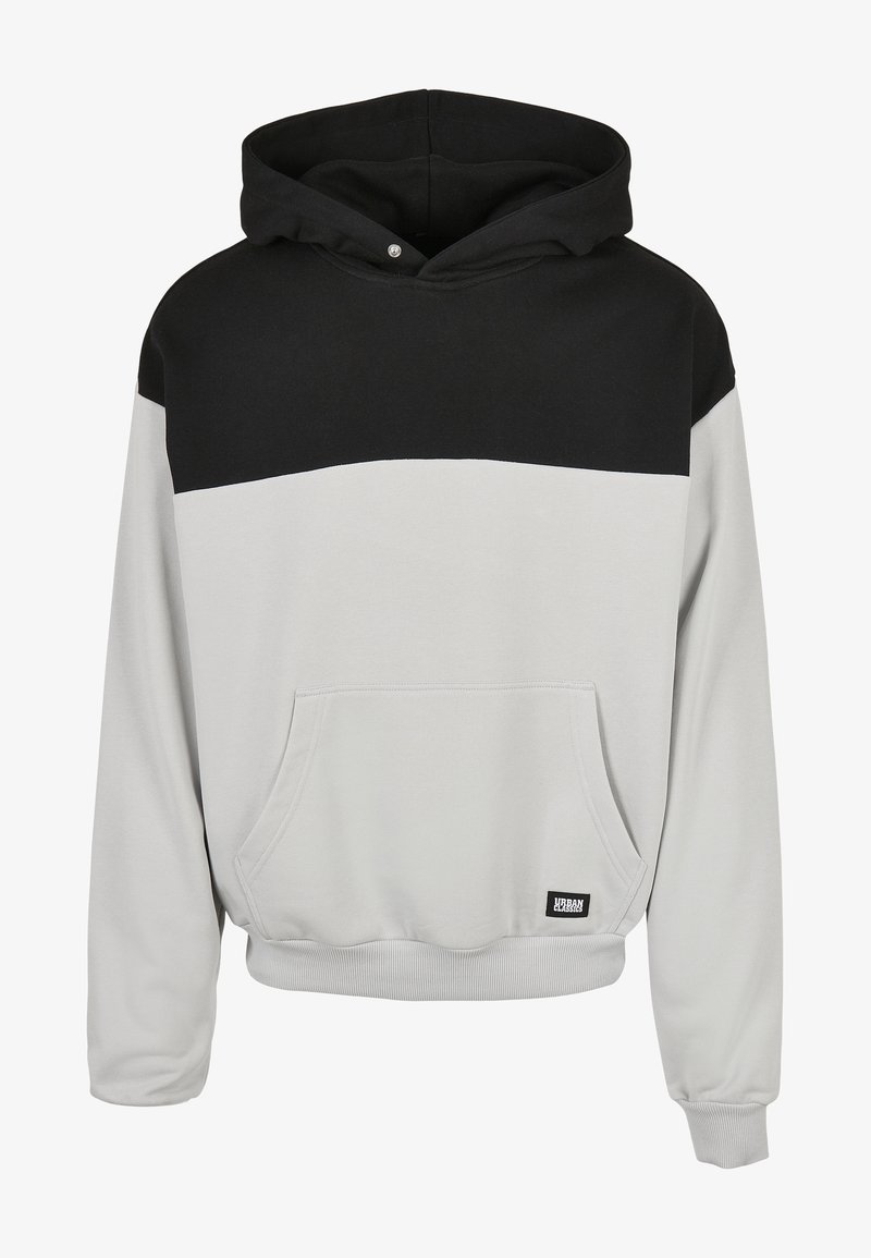 Huvtröja med svart övre del och ljusgrå nedre del, med framfickor av känguru och ribbade muddar och nederkant.