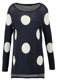 Pull bleu marine en tissu tricoté avec manches longues, décoré de grands pois blancs et d'un ourlet rayé contrastant.