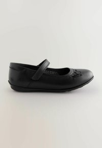 Ballerines en cuir noir avec un nez rond, une sangle élastique et des détails de cœur brodés. Texture lisse et semelle en caoutchouc basse.