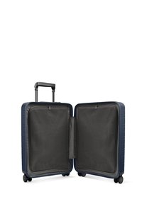 Valise rigide bleu marine avec une poignée rétractable, quatre roues et deux compartiments doublés en maille, comportant un séparateur zippé.