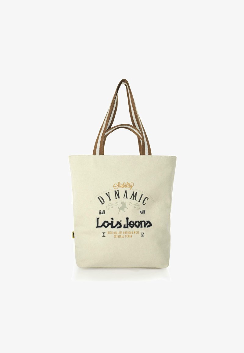 Bolsa de lona de algodón en color crema con asas marrones. Presenta texto impreso "Lois Jeans" y gráficos. Forma rectangular, diseño simple.