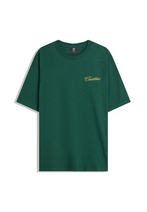 Dark green short-sleeve t-shirt with yellow "Cadillac" text embroidered on the left chest, displayed against a white background.