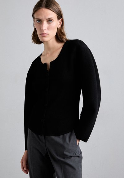 Black ribbed cardigan with a rounded neckline and long sleeves, featuring a button-up front and a fitted silhouette.