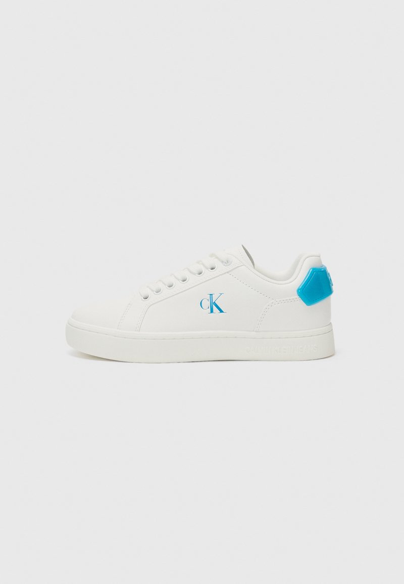 White sneakers with light blue accents, featuring a smooth leather texture, round toe, and lace-up design. Logo detail on the side.