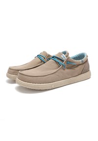 Beige canvas shoes with blue accents, round toe, textured rubber sole, and patterned interior lining. Features a simple lace design.
