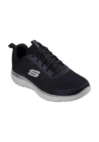 Scarpa sportiva nera con tomaia in rete, motivo testurizzato, lacci e suola bianca ammortizzata. Presenta un logo metallico di lato.