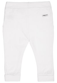 Vita bomullsleggings med en figurnära design, elastisk midja och uppvikta anklar. Har en liten märkesetikett på baksidan.
