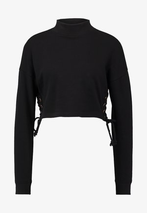 Black cropped sweatshirt with a high neck, featuring side lacing with metal eyelets and drawstrings for adjustability. Long sleeves.