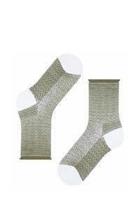 Gemusterte Socken mit einem Fischgrätenmuster in Grün und Weiß, versehen mit einem weißen Bündchen und einem kontrastierenden einfarbigen grünen oberen Rand. Weiche Textur.