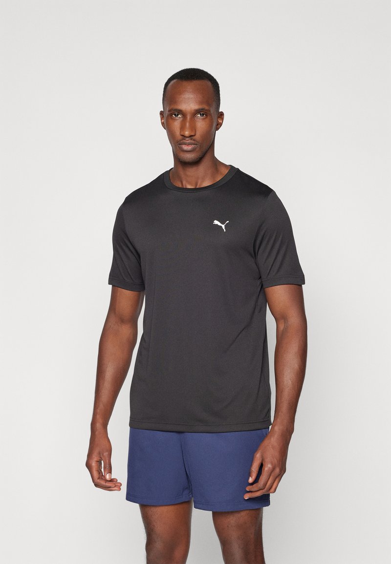 Black sports t-shirt in lightweight, breathable fabric, featuring a round neckline and short sleeves. Small white logo on the chest.
