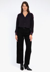 AN'GE SOURRIA - Blouse - noir