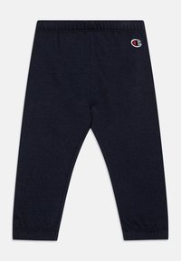 Leggings de mezcla de algodón color azul marino con una textura suave, cintura elástica y pequeño logo bordado en la cadera izquierda. Sin bolsillos ni patrones.