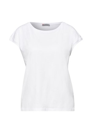 Haut décontracté blanc à manches courtes pour femme avec un col rond et une coupe ample, montrant l'étiquette intérieure "Street One."