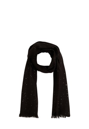 Écharpe noire avec un motif de points argentés, en tissu doux, avec des bords effilochés. Drapée en style loop.