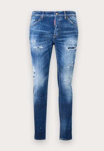 Μπλε τζιν skinny με φθαρμένες περιοχές και ξεθωριασμένα σημεία, που διαθέτουν πέντε τσέπες και κούμπωμα με κουμπιά.