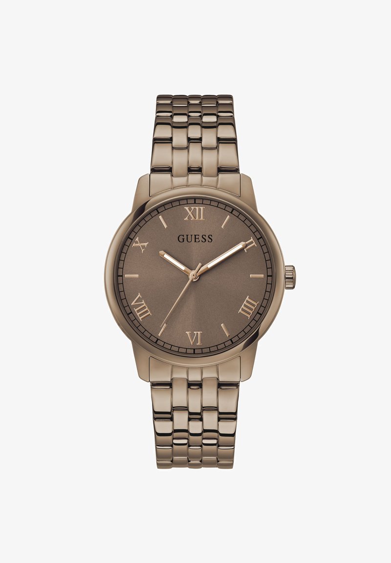 Montre-bracelet Guess métallique marron avec chiffres romains, trois aiguilles et un bracelet à maillons, affichant l'heure à 10h10min36s.
