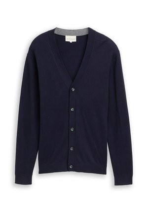 Marineblaues Langarmhemd mit Knopfleiste, V-Ausschnitt und gerippten Bündchen, flach auf einem weißen Hintergrund präsentiert.