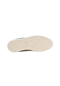 Suola di scarpa con un motivo di presa testurizzato in gomma beige. La forma è piatta con bordi arrotondati e presenta un design pulito e minimalista.