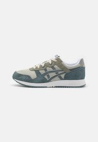 Sneakers featuring a mix of light green and gray suede with mesh panels, a white midsole, and dark green accents on the sole.