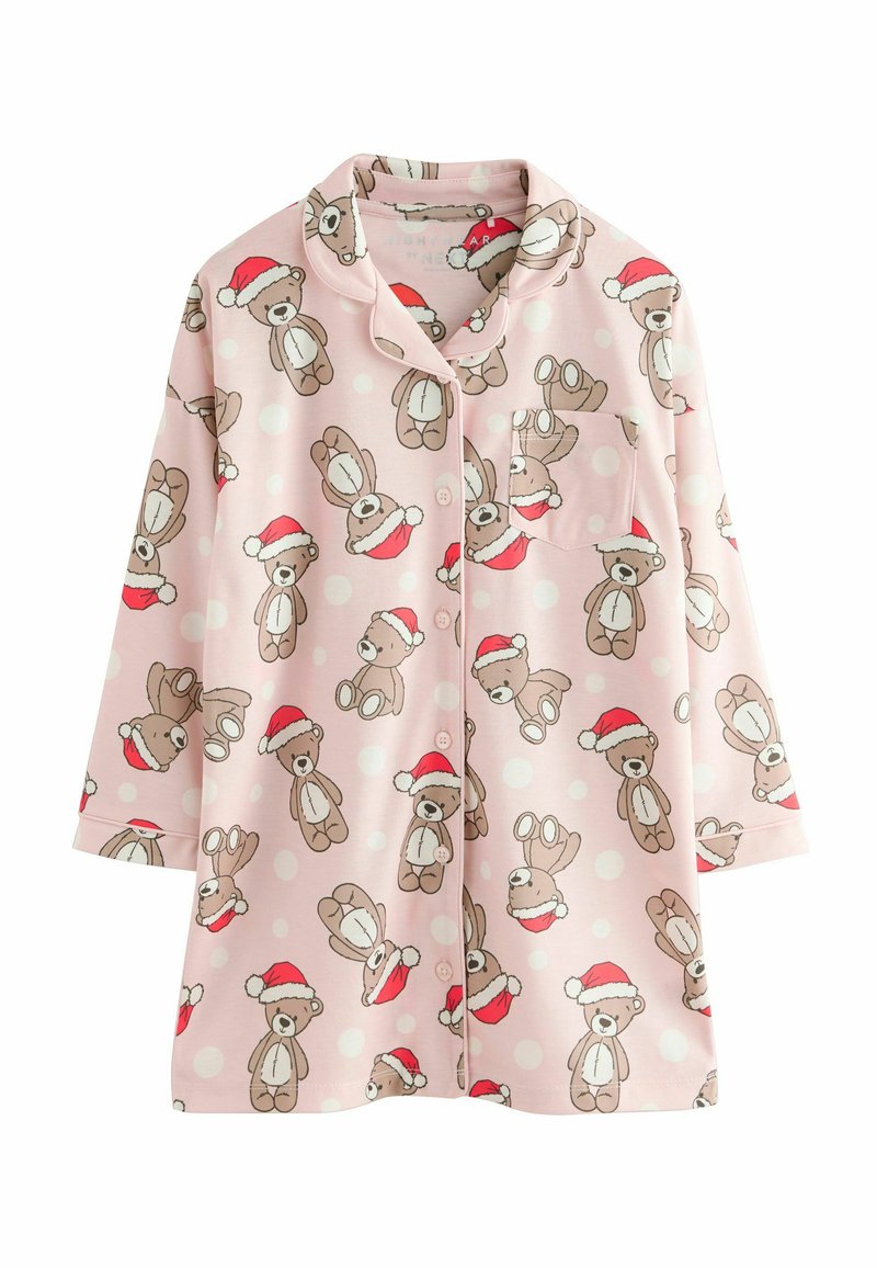 Pink pajama top with short sleeves featuring a repeated teddy bear pattern wearing Santa hats, with white polka dots and a chest pocket.