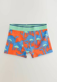 Børneboxershorts lavet af bomuld med en lys orange baggrund, der har blå dinosaur mønstre og et grønt elastisk taljebånd.