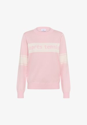 Sweatshirt en tricot rose avec un col rond, présentant une rayure horizontale blanche et le texte "après tennis" dans une couleur assortie. Poignets côtelés.