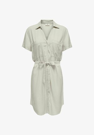 Svara piedurkņu, pogājams kleita gaiši bēšā lina audumā, ar divām krūšu kabatām un jostu vidukļa daļai, lai pielāgotu fit.