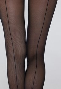 Black sheer tights featuring a vertical black line running down the back of each leg, smooth texture with a slightly glossy finish.