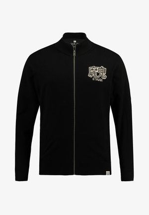 Sort zip-up cardigan lavet af blødt stof, med høj krave, sidelommer og broderede detaljer på brystet.