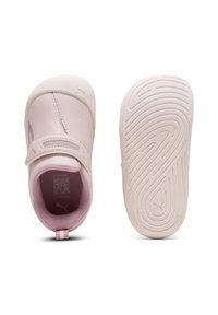 Light pink toddler shoes with Velcro strap, soft textured upper, and patterned sole featuring Puma logo, shown top and bottom views.