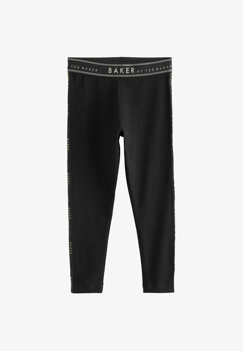 Juodos tamprės, pagamintos iš elastingos medžiagos, su auksiniu logotipu šone ir plačia juosta, pasižyminčios lygiu paviršiumi.