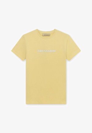 Bladożółta bawełniana koszulka z krótkim rękawem z haftowanym na środku klatki piersiowej napisem "TRUSSARDI" w kolorze białym.